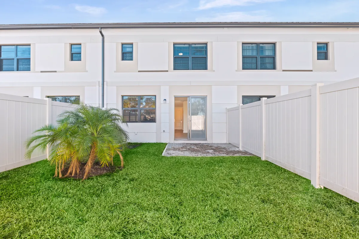 Rear elevation seen from inside the fenced yard