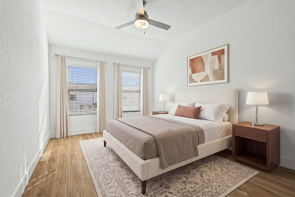 Opal bedroom with a queen bed centred on the wall, two walnut nightstands with lamps, a rug, abstract art and curtains on both windows. Virtually staged.